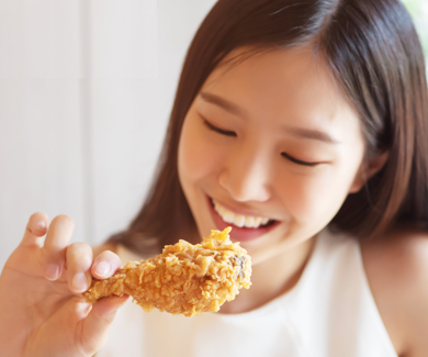 Female eating chicken